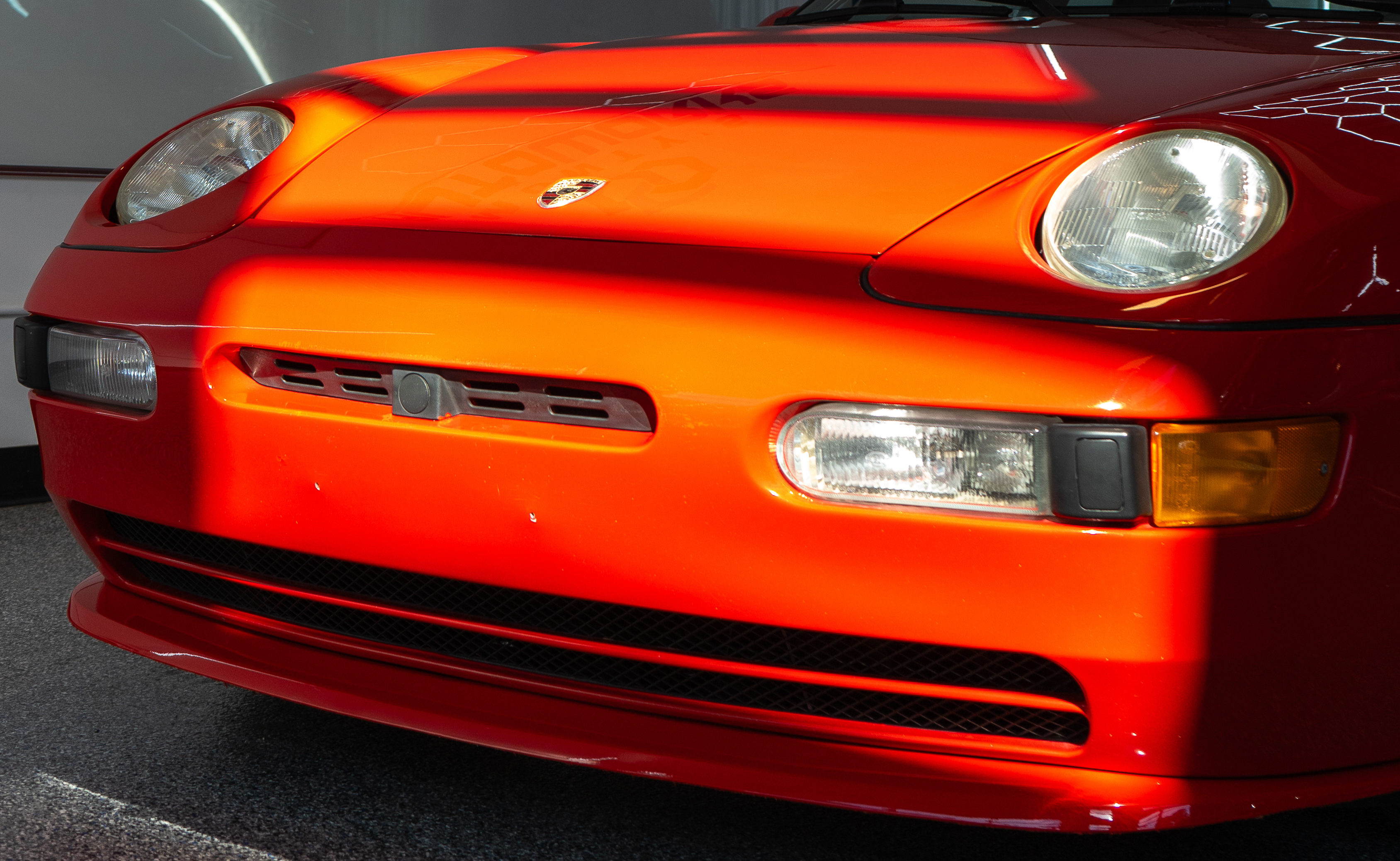 Front detail shot of a red classic car